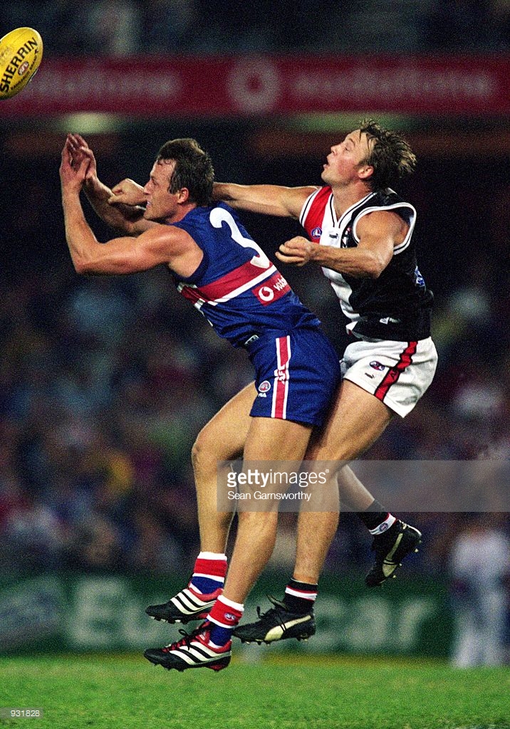 mar-2001-chris-grant-of-the-bulldogs-and-max-hudghton-of-st-kilda-in-picture-id931828