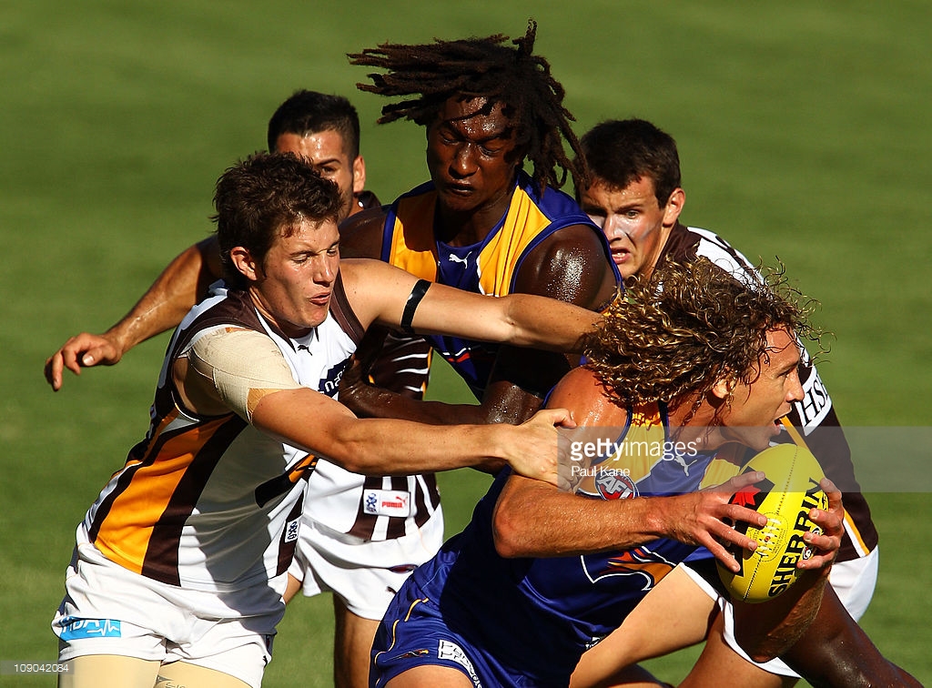 matt-priddis-of-the-eagles-attempts-to-break-from-a-tackle-by-will-picture-id109042084