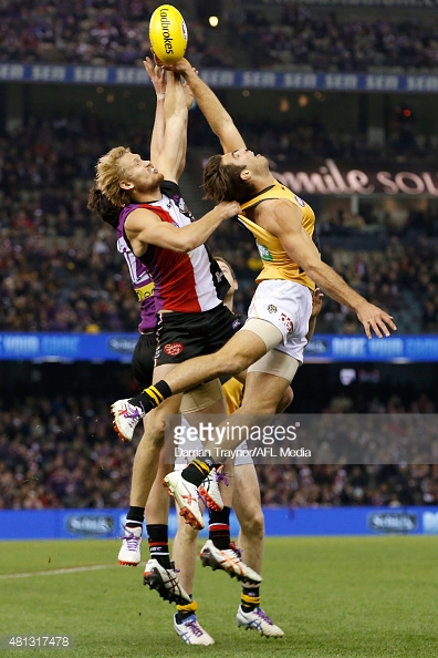 sam-gilbert-of-the-saints-and-alex-rance-of-the-tigers-compete-during-picture-id481317478