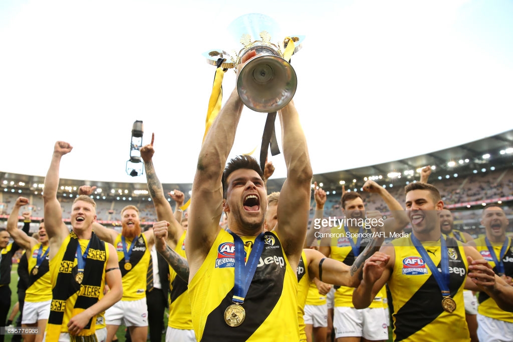 tigers-captain-trent-cotchin-celebrates-with-team-mates-and-holds-the-picture-id855776986