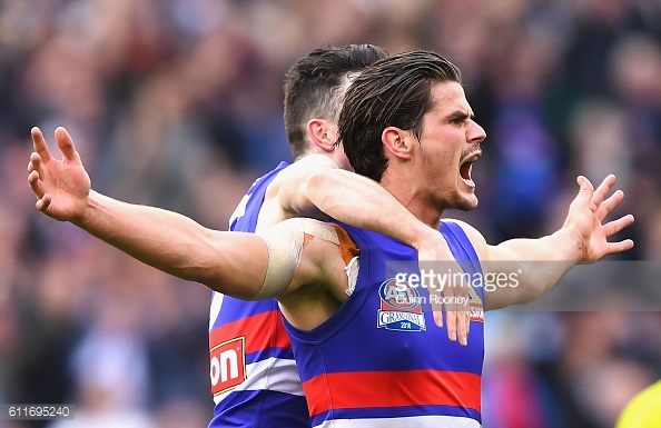 tom-boyd-of-the-bulldogs-celebrates-kicking-a-goal-during-the-2016-picture-id611695240