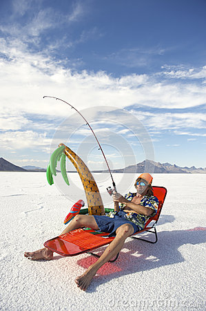 american-fisherman-goes-cheap-fishing-vacation-holiday-redneck-inflatable-palm-tree-white-desert-35578143.jpg