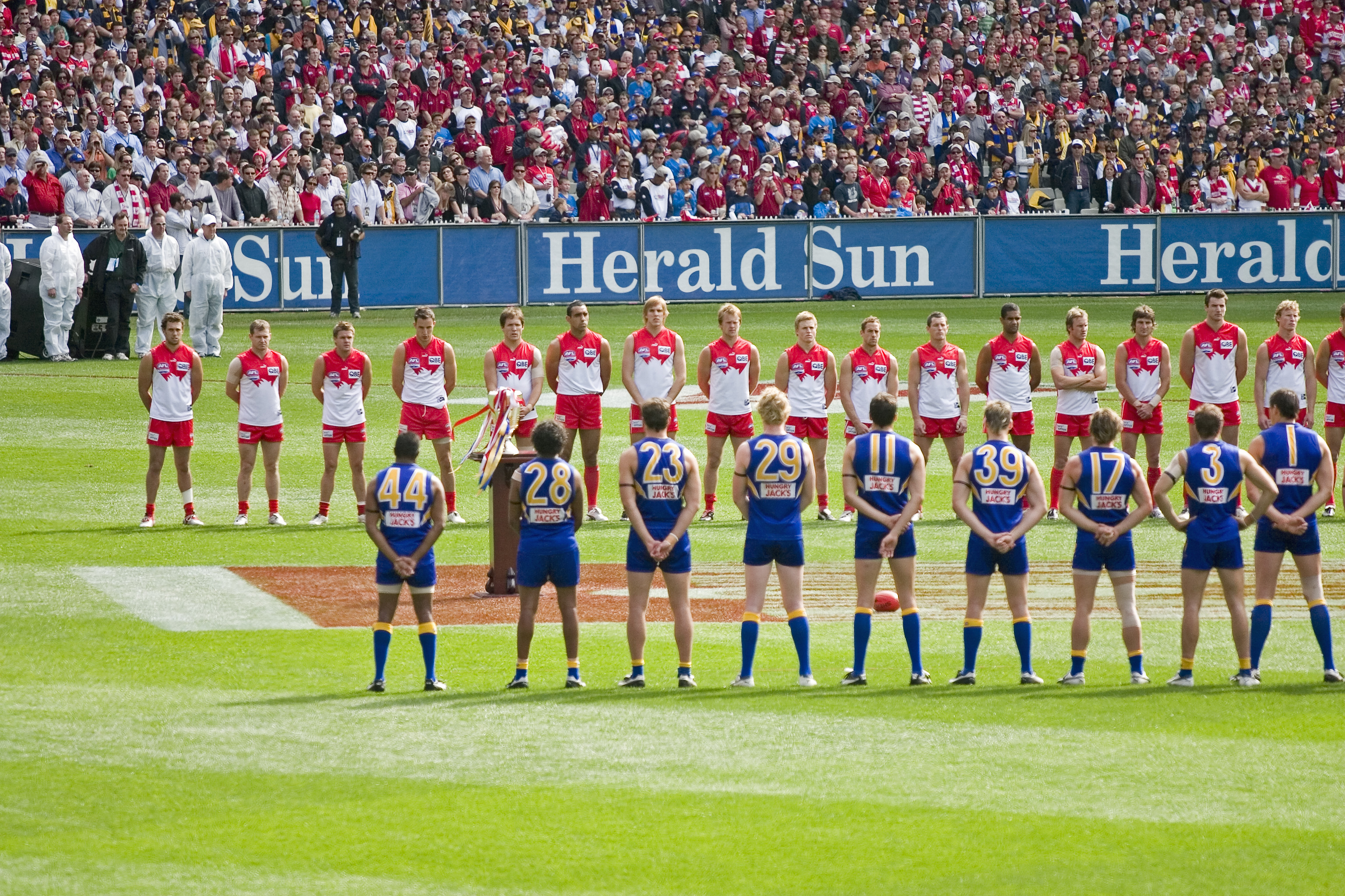 The_teams_line_up_for_the_national_anthem%2C_2005_AFL_Grand_Final.jpg