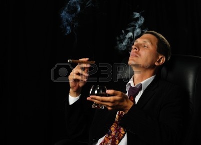 7806746-the-man-with-a-cigar-and-a-glass-of-cognac-a-dark-background.jpg
