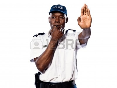 14683227-portrait-of-an-afro-american-police-officer-holding-a-hand-up-to-motion-stop-while-blowing-whistle-o.jpg
