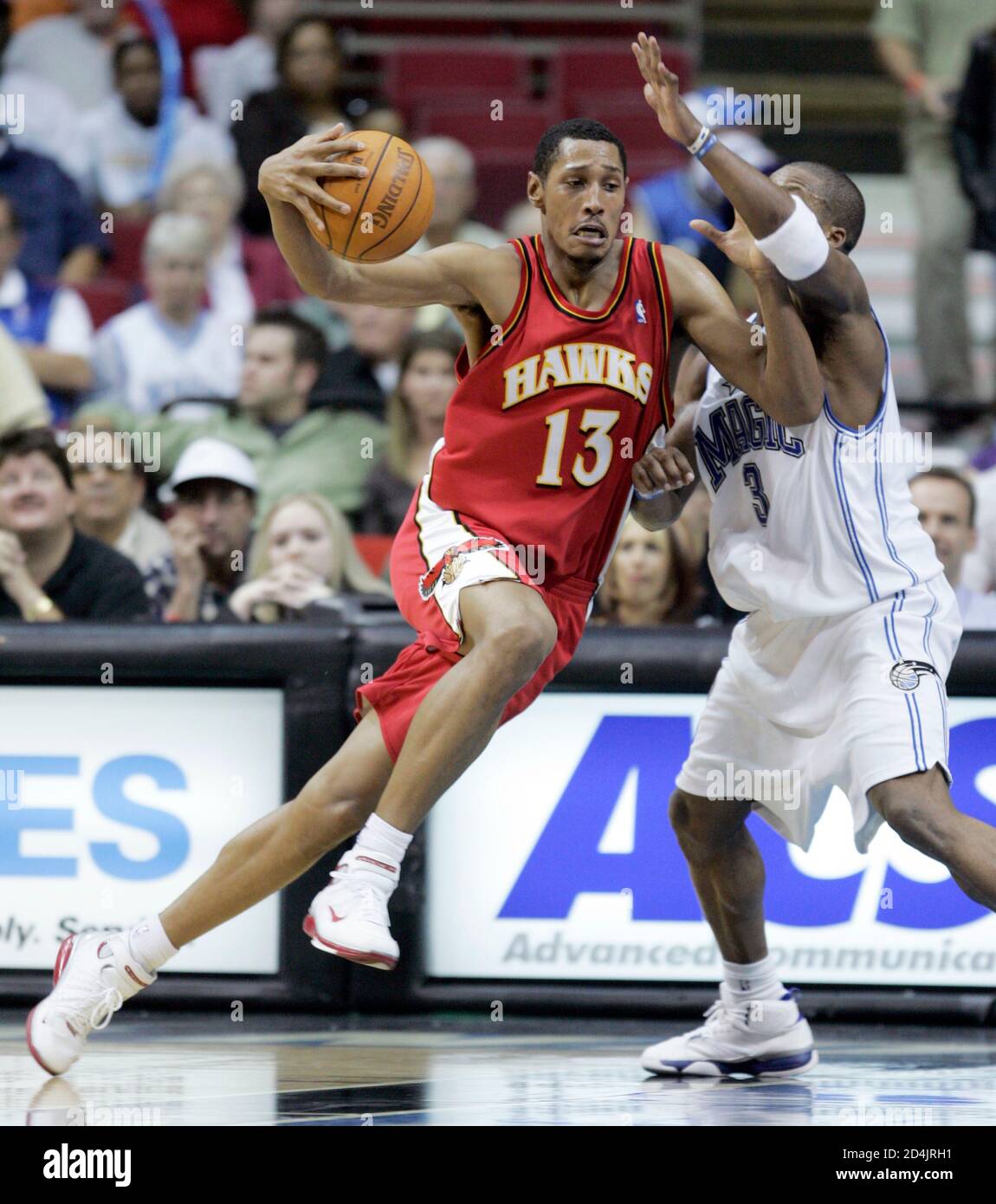 atlanta-hawks-guard-boris-diaw-l-of-france-drives-against-orlando-magic-guard-steve-francis-during-second-half-nba-action-in-orlando-florida-february-10-2005-magic-beat-the-hawks-101-96-reuterskevin-kolczynski-kksv-2D4JRH1.jpg