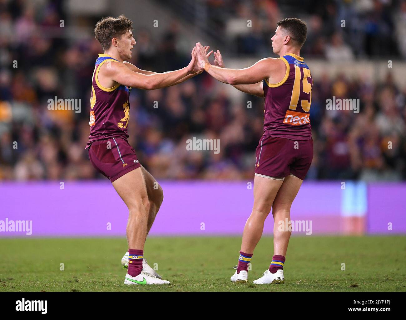 zac-bailey-of-the-lions-left-reacts-with-dayne-zorko-after-kicking-a-goal-during-the-round-10-afl-match-between-the-brisbane-lions-and-richmond-tigers-at-the-gabba-in-brisbane-friday-may-21-2021-aap-imagedave-hunt-no-archiving-editorial-use-only-strictly-editorial-use-only-no-commercial-use-no-books-2JYP1PJ.jpg