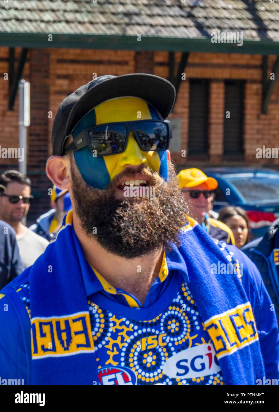 west-coast-eagles-football-club-fan-and-supporter-with-painted-face-at-2018-afl-grand-final-at-the-mcg-melbourne-victoria-australia-PTNMKT.jpg