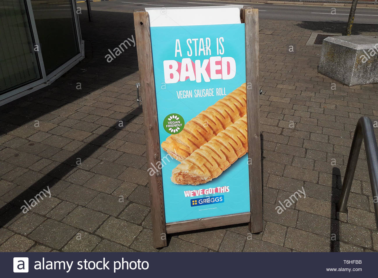 greggs-vegan-sausage-roll-advertising-board-outside-a-branch-in-stratford-upon-avon-warwickshire-uk-on-may-1-2019-T6HFBB.jpg