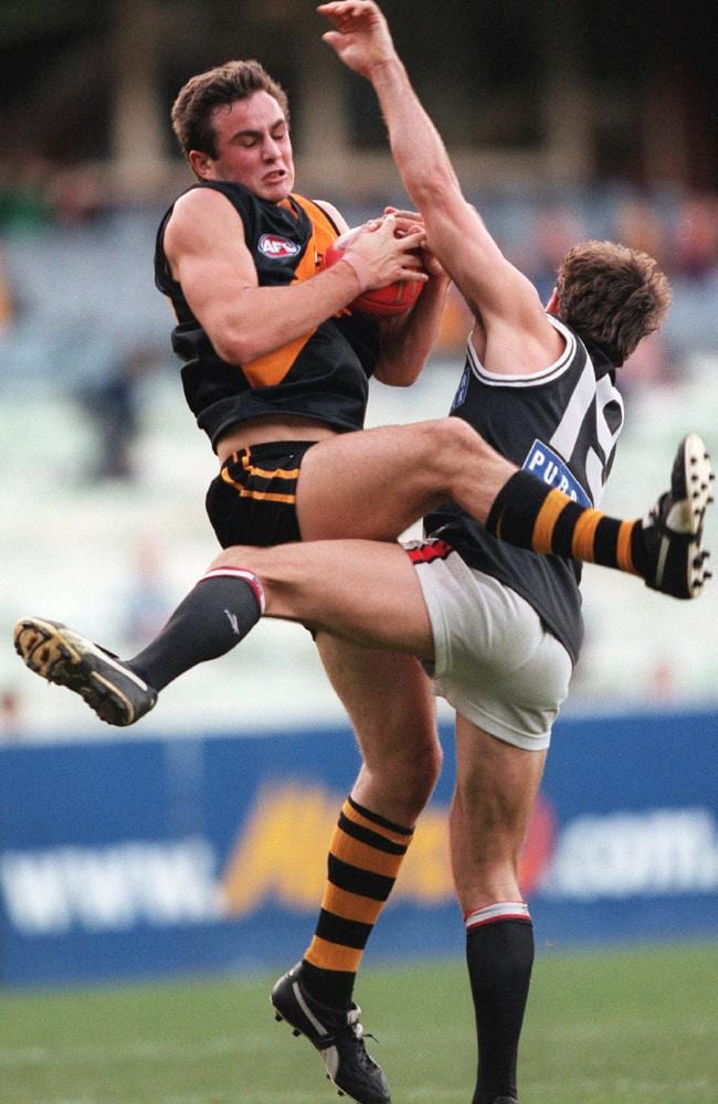 Ty Zantuck takes a mark over Steven Sziller in his AFL debut.