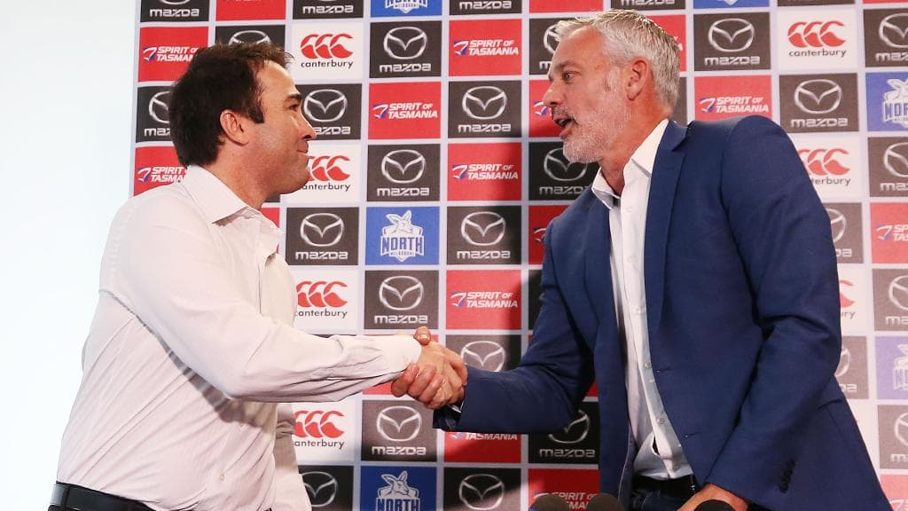 Brad Scott shakes hands with chief executive Ben Buckley at his departure press conference. Picture: Getty Images