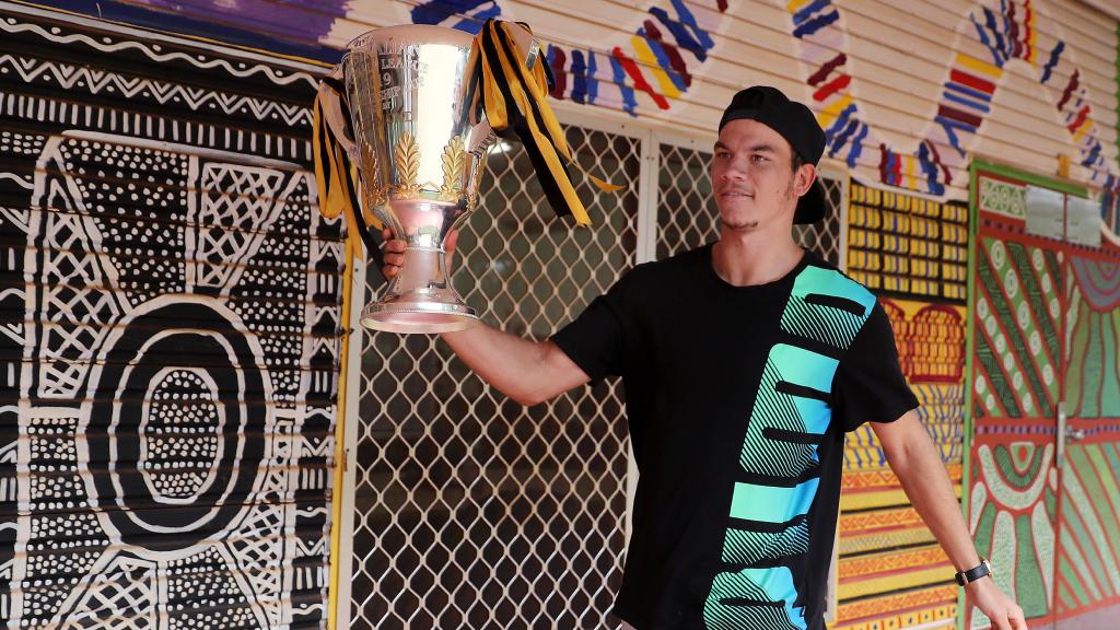 Daniel Rioli took the premiership cup home to the Tiwi Islands. Picture: Michael Klein