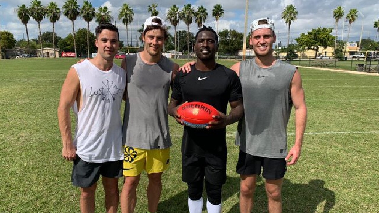 Western Bulldogs pair Josh Dunkley and Hayden Crozier with fallen NFL superstar Antonio Brown.