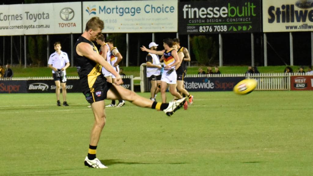 Glenelg’s Luke Reynolds kicks for goal. Picture: Flash Gordon Photography