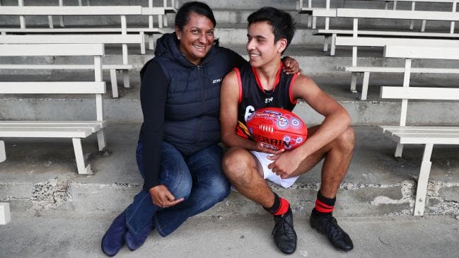 Nova Peris with her son Jack, a prospective AFL player and sprinter who has been included in the Flying Boomerangs squad. Picture: Aaron Francis