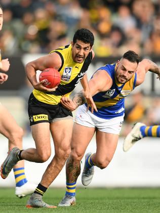 Marlion Pickett breaks a tackle during last year’s VFL Grand Final between Richmond and Williamstown at Ikon Park. Under Ryan’s plan, Williamstown would merge with Western Jets. Picture: Getty