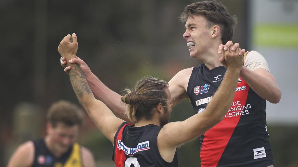 Riley Thilthorpe celebrates a goal with West Adelaide teammate Kenny Karpany at league level. Picture: Dean Martin/AAP