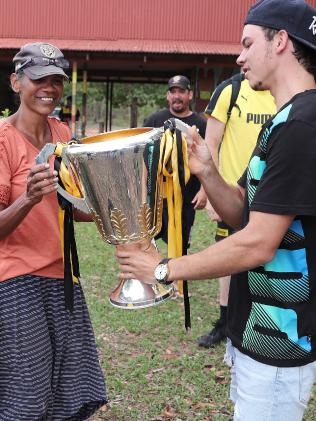 Daniel unwraps the special delivery and shows it to his mum Belinda. Picture: Michael Klein