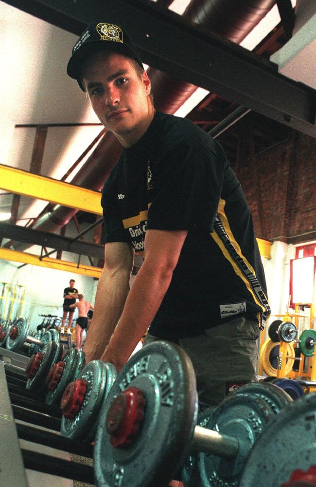 James White poses with the weights in Richmond’s rooms in 1998.