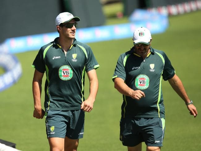 Alex Kountouris walks laps of the WACA with an injured Pat Cummins.