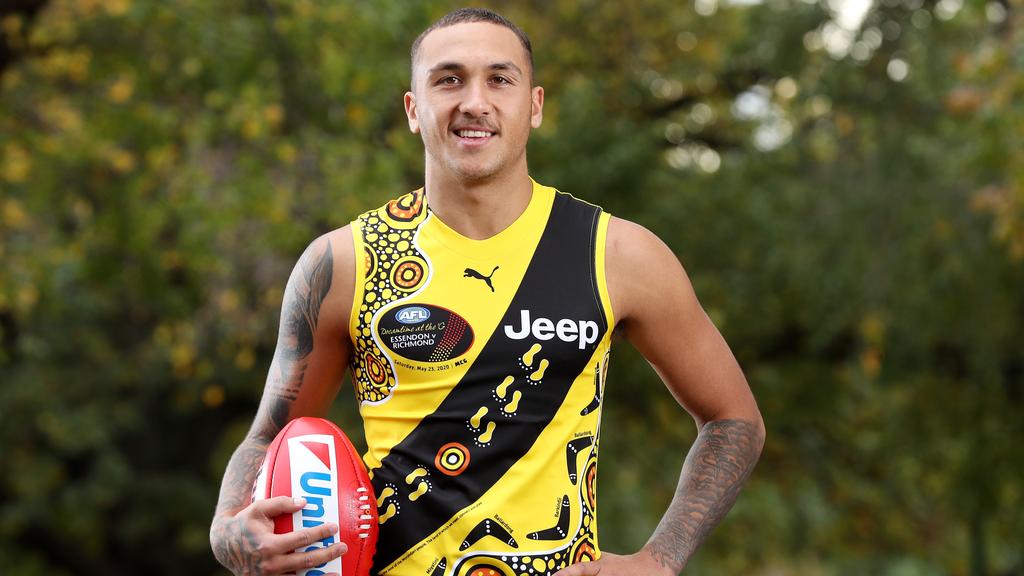 Bolton wearing the Dreamtime at the G guernsey that he designed with his grandmother and family members. Pic: Michael Klein