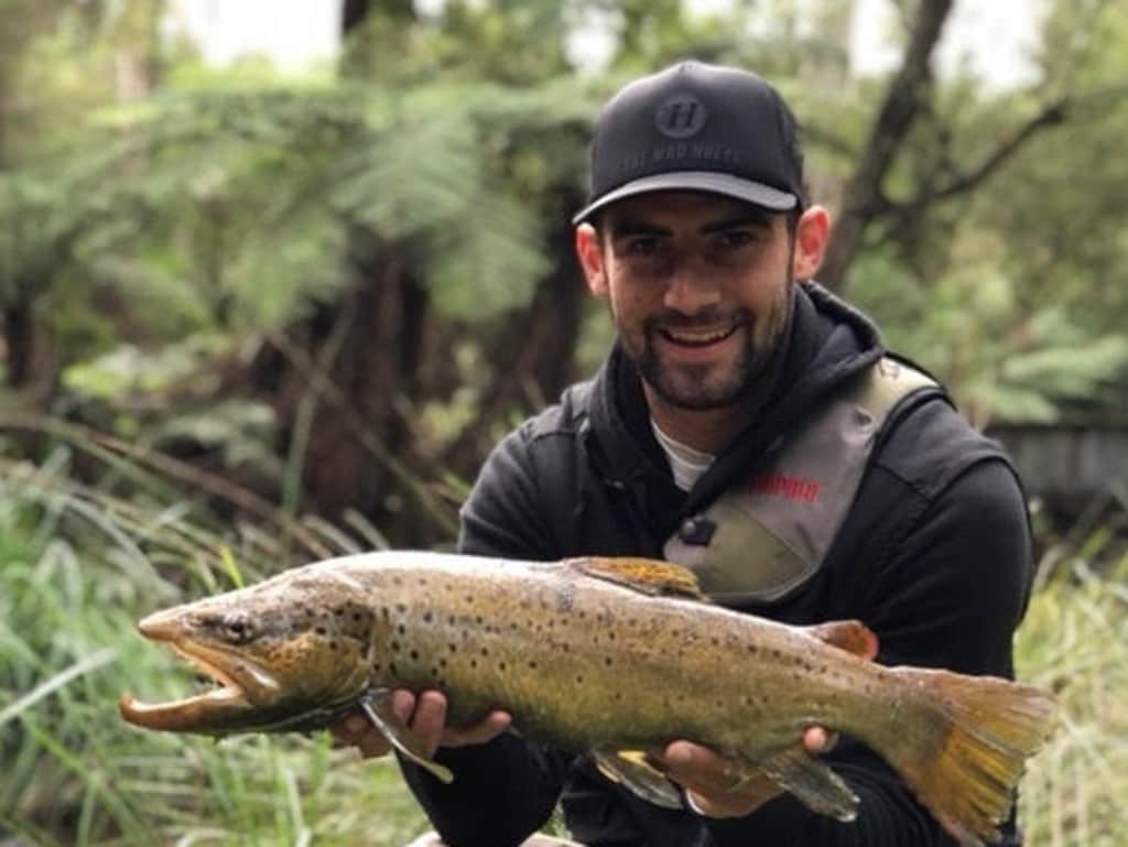 Cunnington catches a trout.