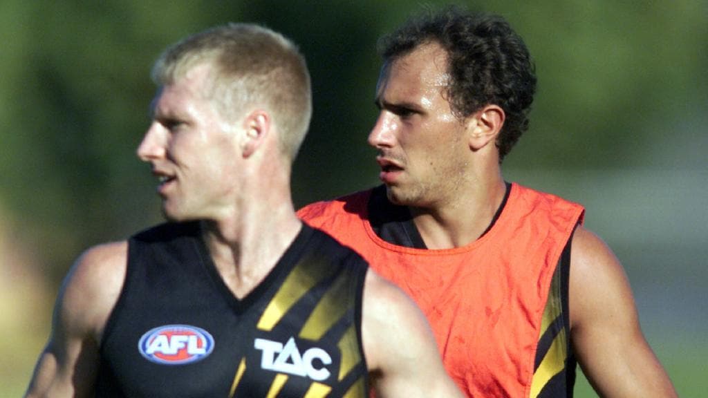 Ezra Poyas (right) shadows Matthew Knights at a Richmond training session in 2000.