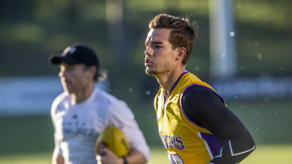 North Melbourne's Jy Simpkin trains at Arden St with the club's high performance manager Jona Segal. Picture: Tim Carrafa's Jy Simpkin trains at Arden St with the club's high performance manager Jona Segal. Picture: Tim Carrafa