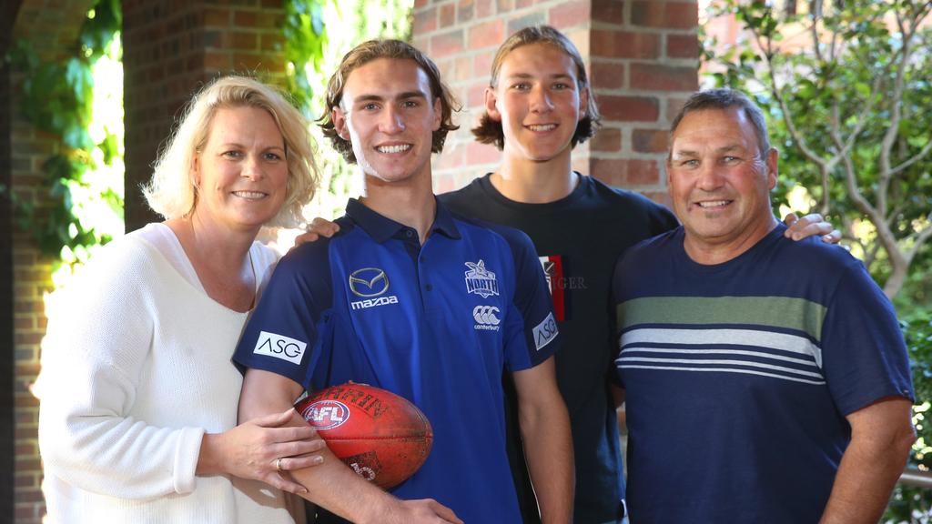 North Melbourne draftee Charlie Lazzaro with his mum Sonia, younger brother Archie and dad Vin. Picture: Peter Ristevski