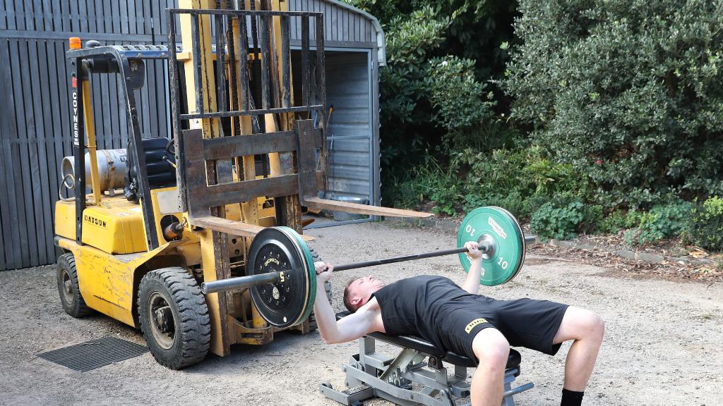 The winery forklift also serves as a bench press and squat rack as Grimes trains in isolation. Picture: Michael Klein