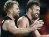 GOLD COAST, AUSTRALIA - JULY 28: Jake Stringer and Cale Hooker of the Bombers celebrate the win during the round 19 AFL match between the Gold Coast Suns and the Essendon Bombers at Metricon Stadium on July 28, 2019 in Gold Coast, Australia. (Photo by Jono Searle/AFL Photos via Getty Images)