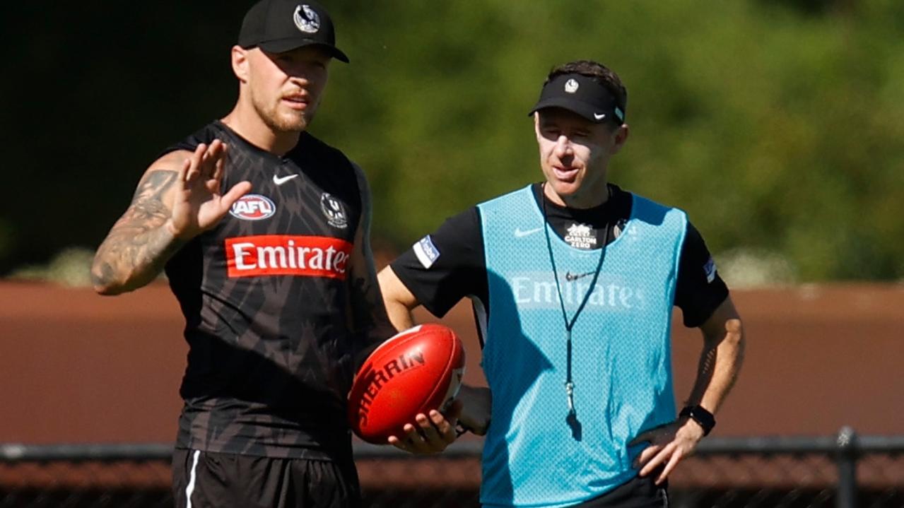 [PLAYERCARD]Jordan De Goey[/PLAYERCARD] speaks with new Magpies coach [PLAYERCARD]Craig McRae[/PLAYERCARD] at training in January.