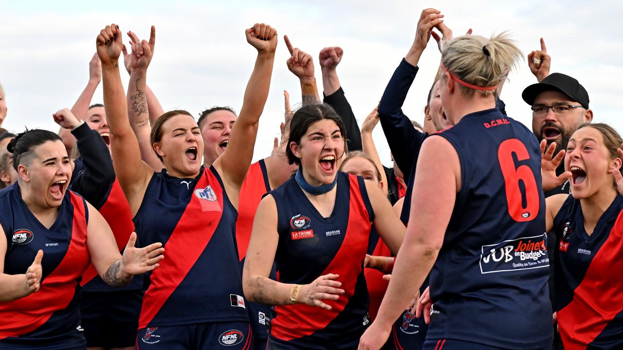 Diamond Creek players congratulate captain Stacey Cross after she won the best-on-ground medal. Picture: Andy Brownbill