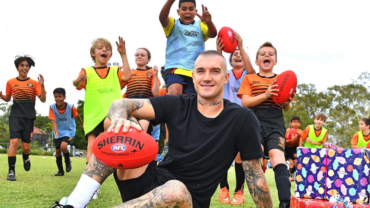 Dustin Martin with kids - Denzel North, Giacomo Calabrese, Samuel Stanway, Arden Hogan, Kyrah Willett and Lucas Berson - from Brisbane youth charity, Kickin with a Cuz, at Eastern Suburbs Football Club in Brisvabe on Friday. Picture, John Gass