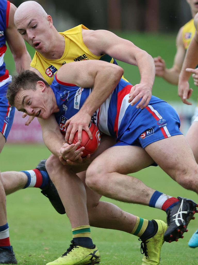 Eagle Adam D'Aloia tackles Central District’s Harry Grant. Picture: David Mariuz/SANFL