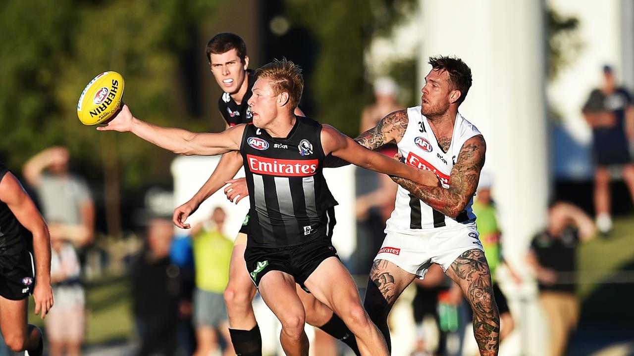 [PLAYERCARD]Jordan De Goey[/PLAYERCARD] and [PLAYERCARD]Dane Swan[/PLAYERCARD] go head-to-head in an intra-club in 2016. Picture: Nigel Hallett