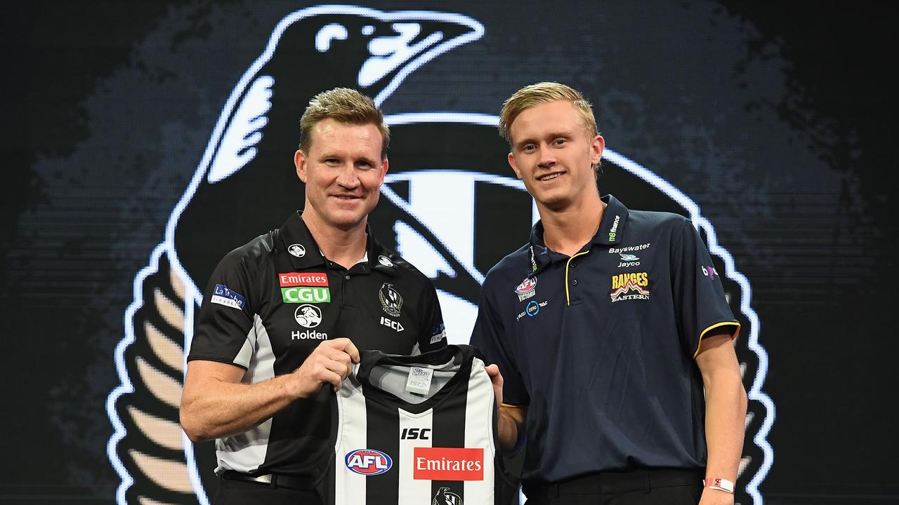 Jaidyn Stephenson with coach Nathan Buckley after being drafted to the Magpies.