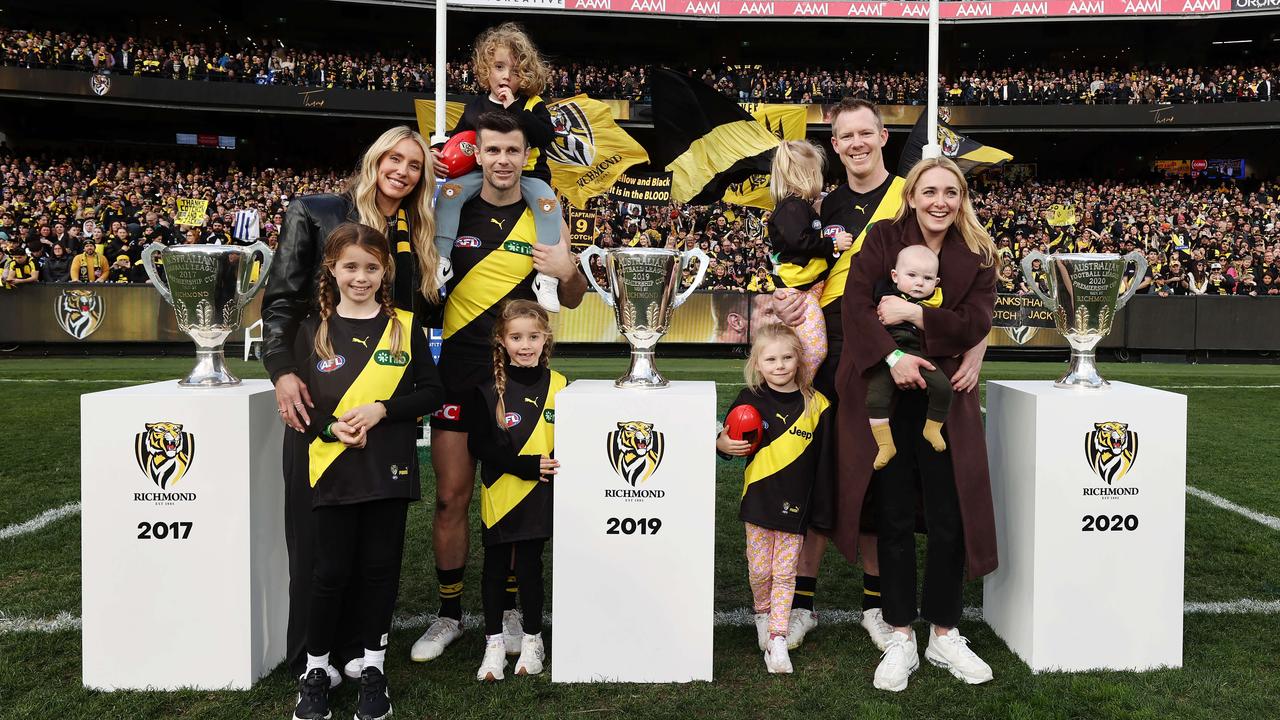 Cotchin and Riewoldt with their families and the three premiership cups after their final game in August this year. Picture: Michael Klein.