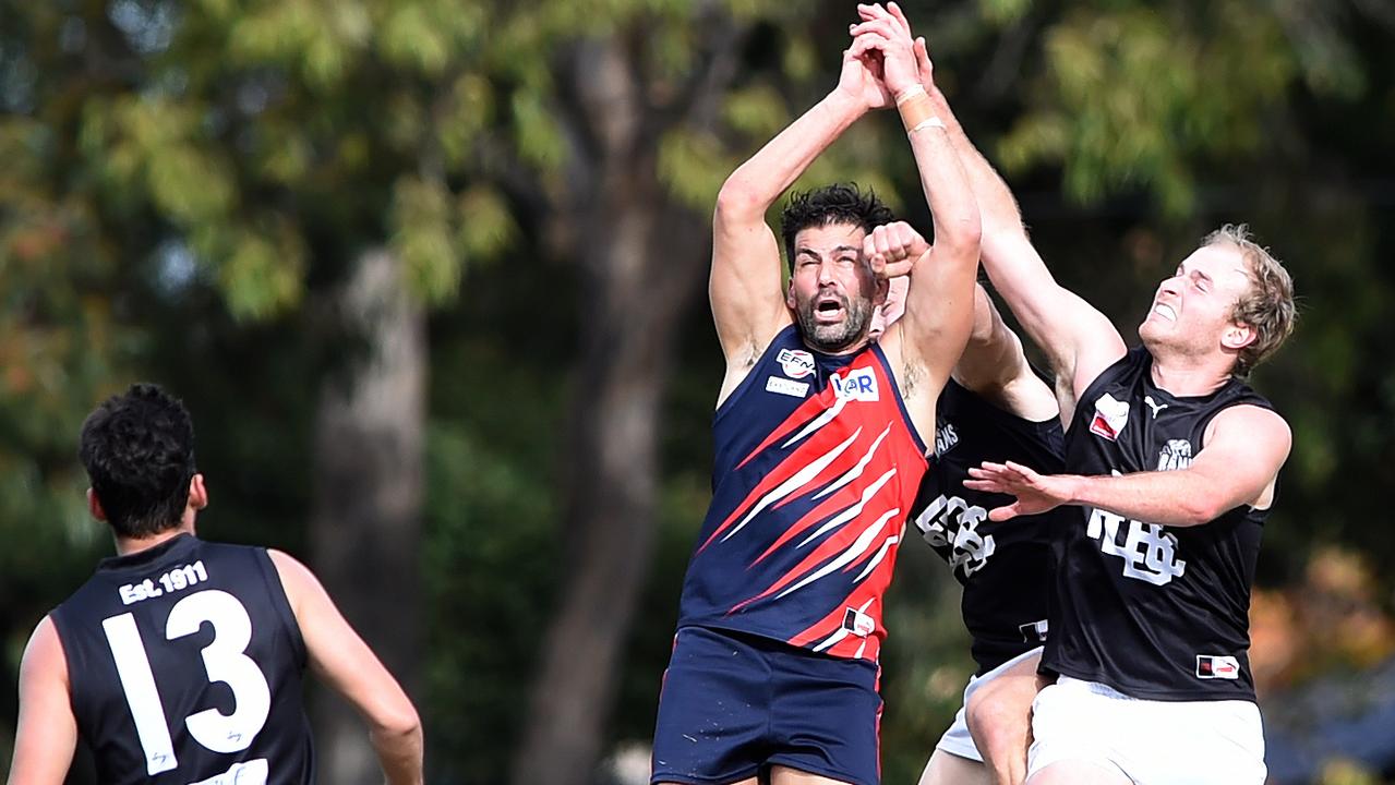 Tom Langford and Ram Luke Brown contest the footy. Picture: Steve Tanner