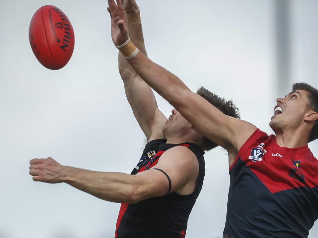 Lewis Pierce (right) playing for Mt Eliza against Frankston Bombers in April. Picture: Valeriu Campan