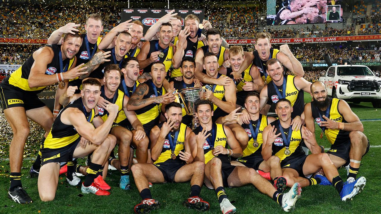 Jubilant Richmond players celebrate their third flag in four years.