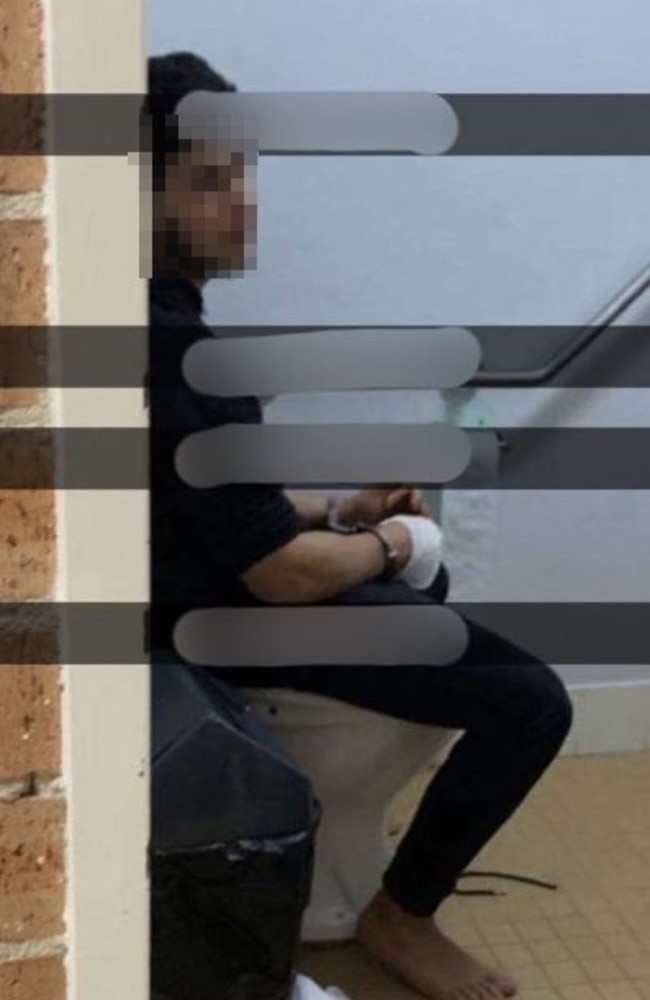 An image shows the teenager handcuffed with a wounded hand.