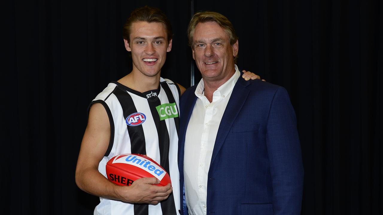 Darcy Moore with dad Peter after the 2014 AFL draft. Picture: Stephen Harman