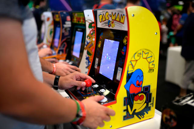 A gamer plays Pac-Man at a trade fair in Cologne, Germany in 2019.