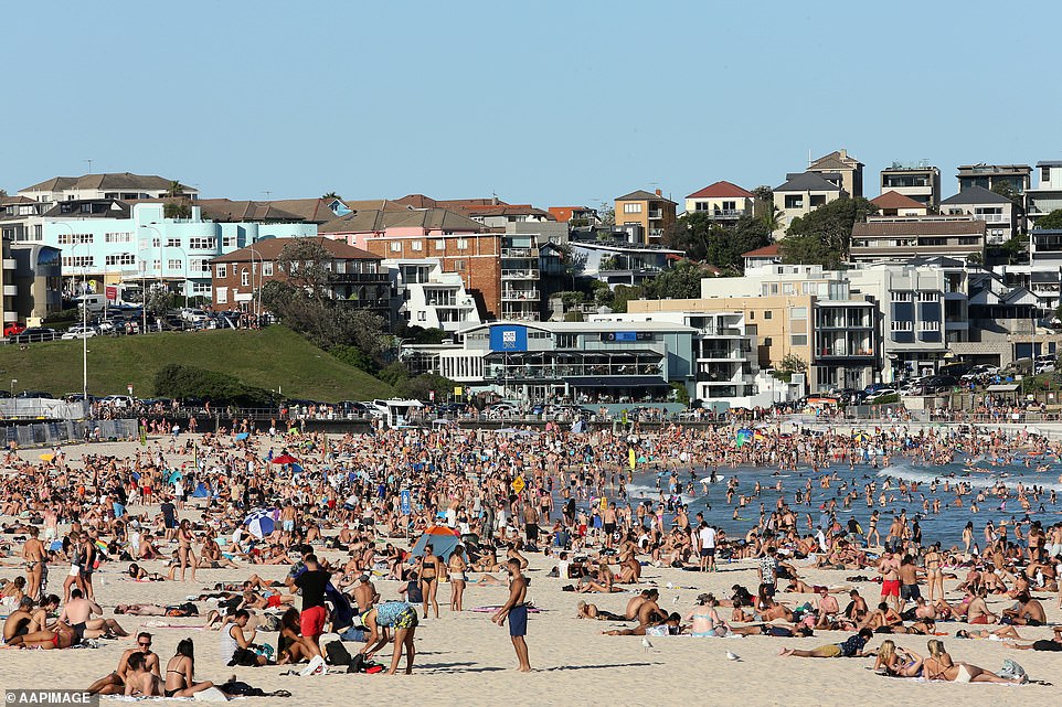 26231434-8158971-Beachgoers_are_seen_at_Bondi_Beach_on_Friday_pictured_despite_th-a-57_1585292531747.jpg