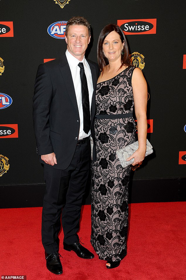 Damien Hardwick regularly referred to his wife Danielle as 'Mrs Hardwick'. The couple are pictured in happier times at the 2014 Brownlow Medal