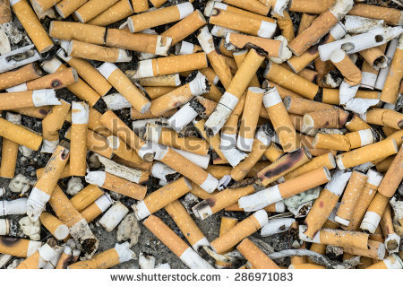 stock-photo-lots-of-cigarette-buds-in-a-large-ash-tray-286971083.jpg