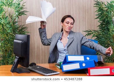 woman-throwing-papers-office-under-260nw-453487288.jpg