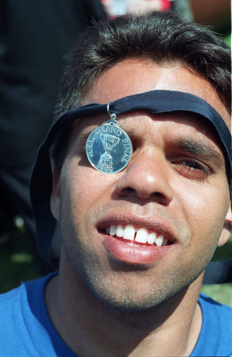 Former Docker Winston Abraham with his Grand Final medal in 1999.