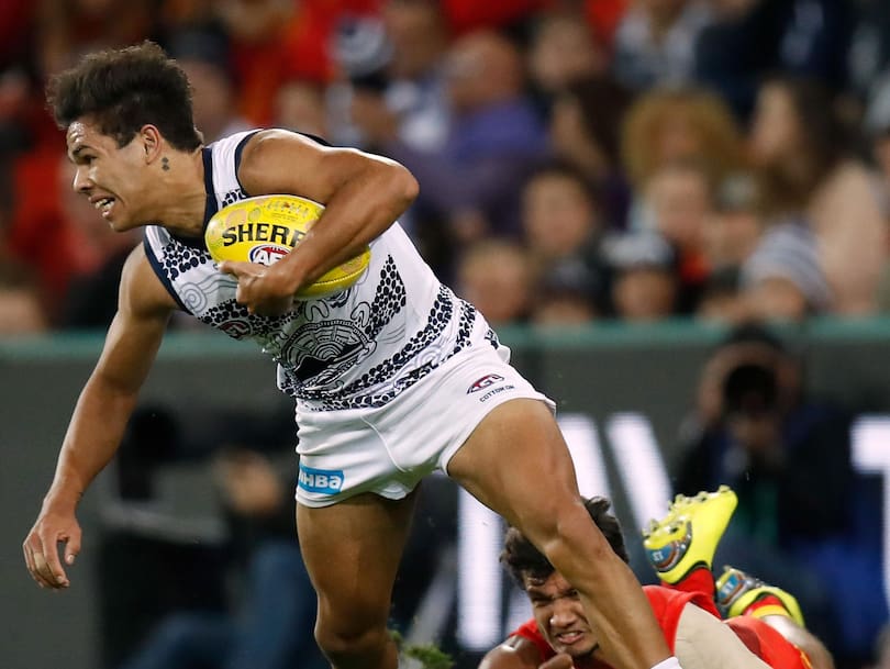 Jamaine Jones and Callum Ah Chee in action during the 2018 AFL round 11 match between the Gold Coast Suns and the Geelong Cats.